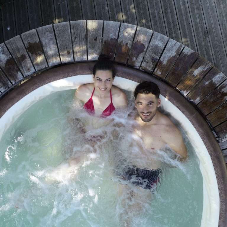 Aerial view of couple in jacuzzi