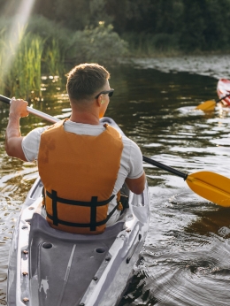 Couple together kayaking on the river