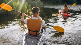 Couple together kayaking on the river